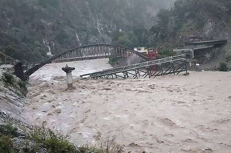 A bridge collapsed following heavy rainfalls in northern India