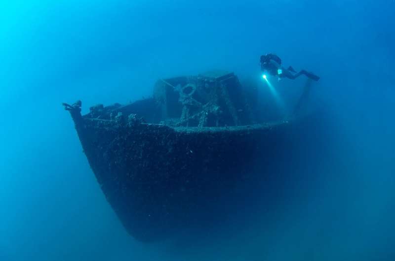 A diver surveys the wreckage of a warship sunk in the World War I Gallipoli Campaign off the coast of Canakkale