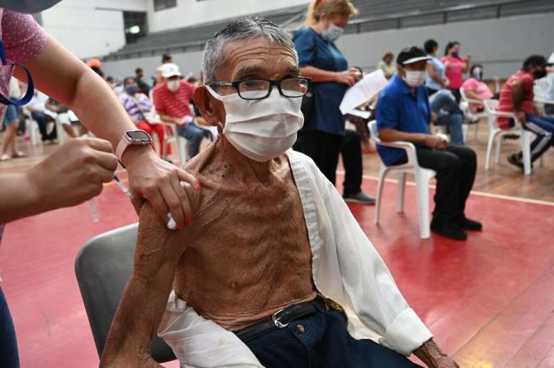 A man is inoculated with the Sputnik V vaccine against Covid-19 in San Lorenzo, Paraguay on May 21 2021