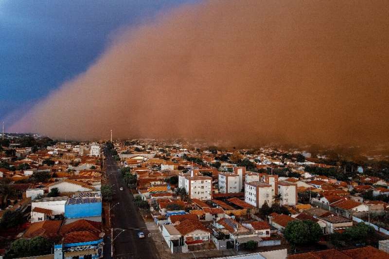 A massive dust storm is seen engulfing the neighborhood of Nossa Senhora do Carmo at the city of Frutal, Minas Gerais state, Bra