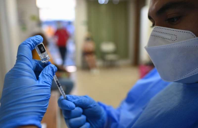 A nurse prepares a dose of the Pfizer vaccine on Taboga Island in Panama on May 21, 2021