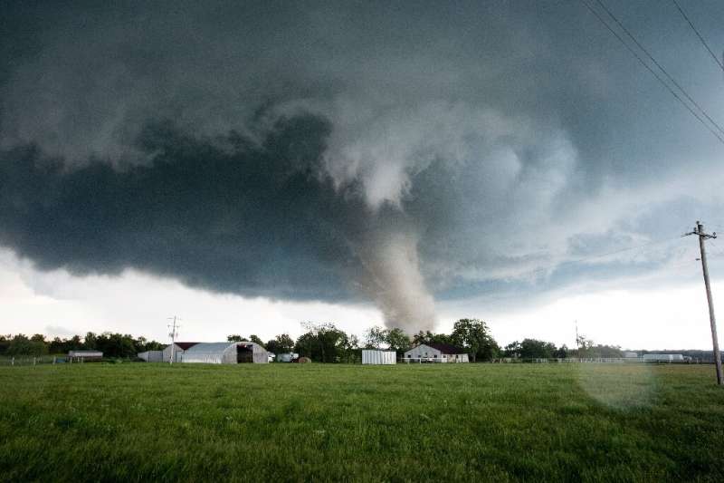 A tornado rips through a residential area after touching down south of Wynnewood, Oklahoma on May 9, 2016.