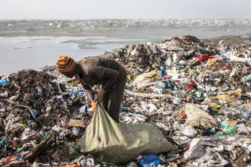 About 2,000 pickers ignore the stench and the fumes and make money by scavenging for plastic, iron and aluminium among the rubbi