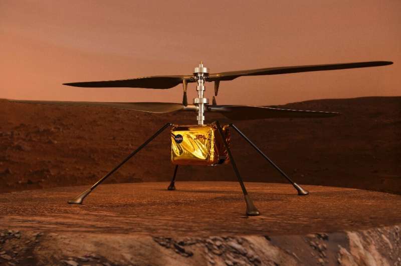 A full scale model of the experimental Ingenuity Mars Helicopter, which will be carried under the Mars 2020 Perseverance rover, 