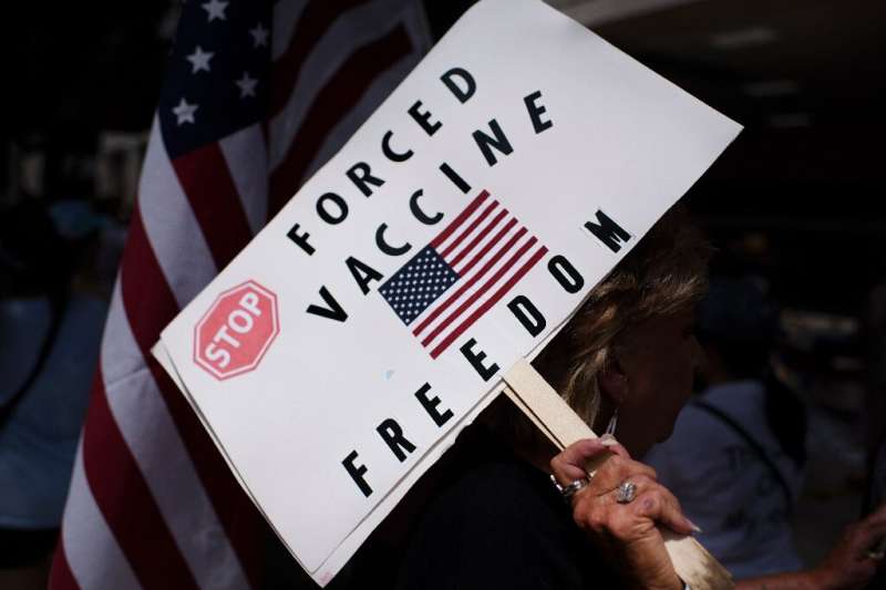 Anti-vaccine rally protesters hold signs outside of Houston Methodist Hospital in June 2021 - employees had sought to overturn a