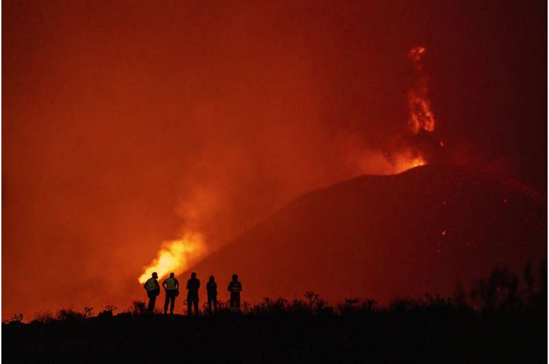 Ash from erupting volcano forces Spanish islanders indoors