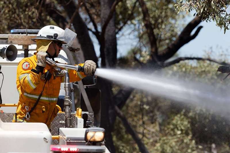 Australian firefighters are battling an out-of-control bushfire that is threatening lives and homes in Perth
