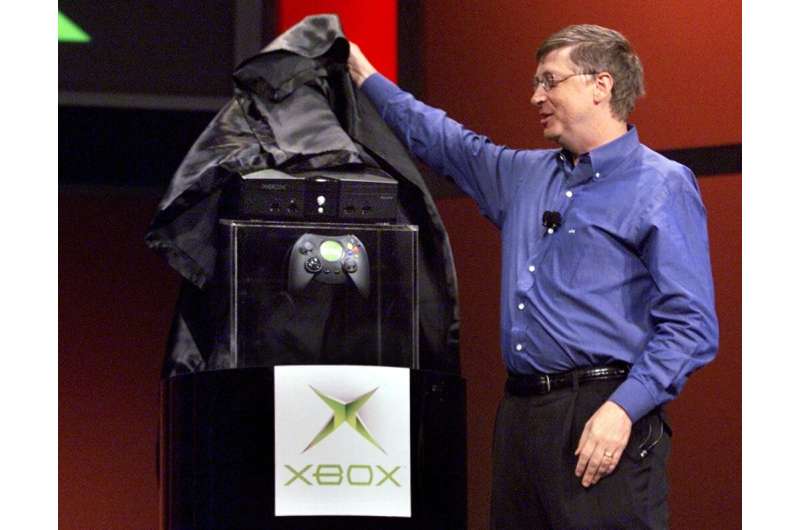 Bill Gates unveiling the Xbox in 2001. Halo, the debut title for the console, helped drive sales