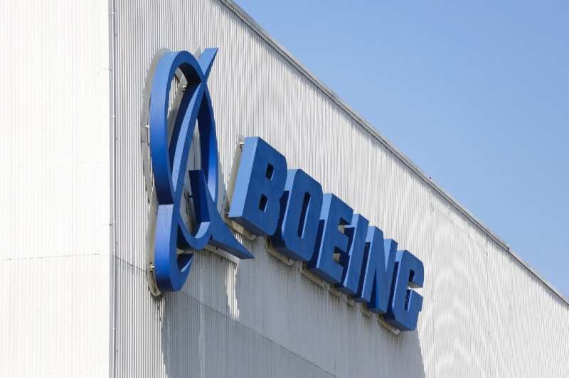Boeing shares surged after it reported a surprise profit and said it would cut fewer jobs than previously expected