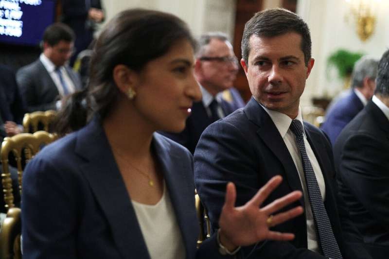 Chairperson of the Federal Trade Commission Lina Khan (L) with Transportation Secretary Pete Buttigieg as they at the White Hous