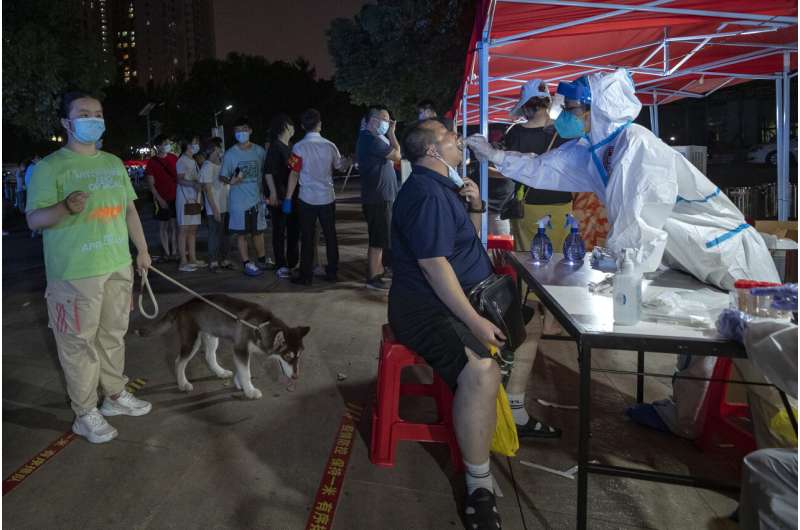 China seals city as its worst virus outbreak in a year grows