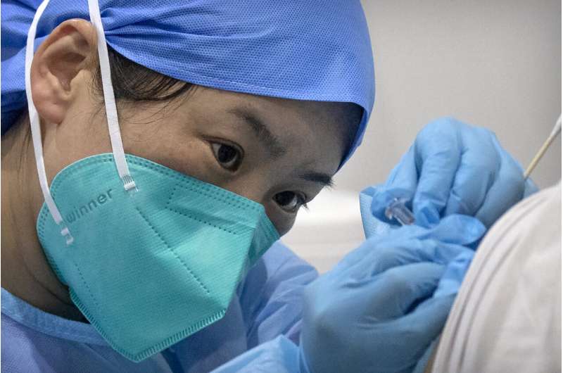 China aims to vaccinate 70-80% of population by mid-2022