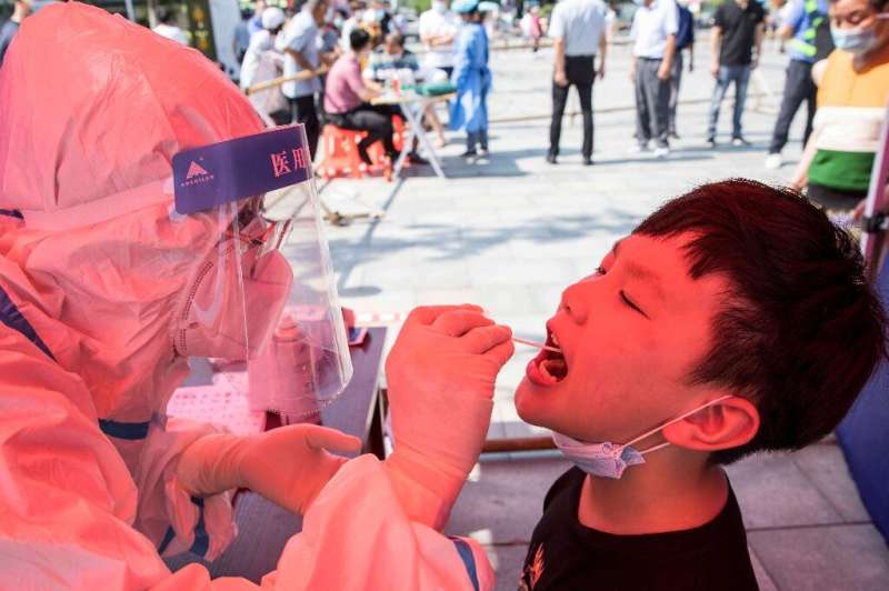 China's worst surge of coronavirus infections in months has spread to 14 provinces