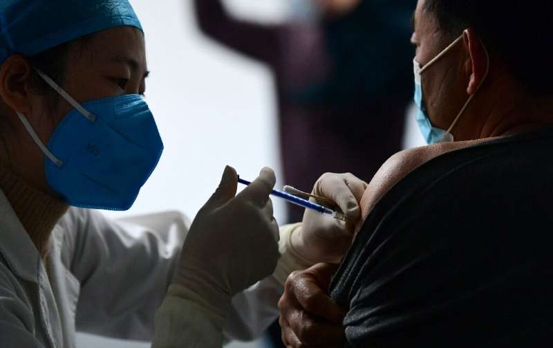 China's current vaccination pace is of &quot;great concern&quot;, infectious-disease specialist Zhang Wenhong has said