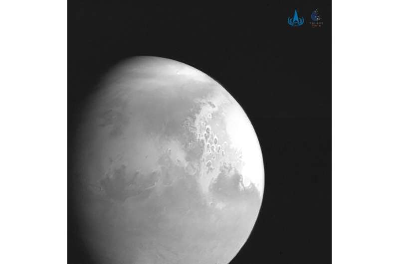 China's space probe has sent back its first image of Mars and is scheduled to touch down on the Red Planet later this year