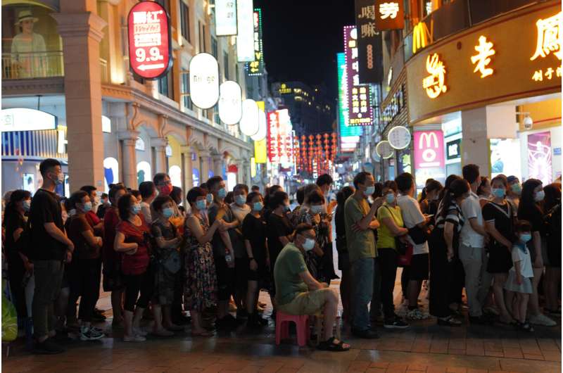 Chinese city locks down neighborhood after virus upsurge