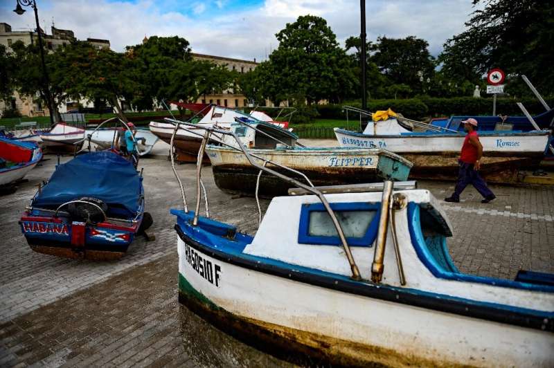 Cuban fishermen dragged their boats to safety as tropical storm Elsa approached