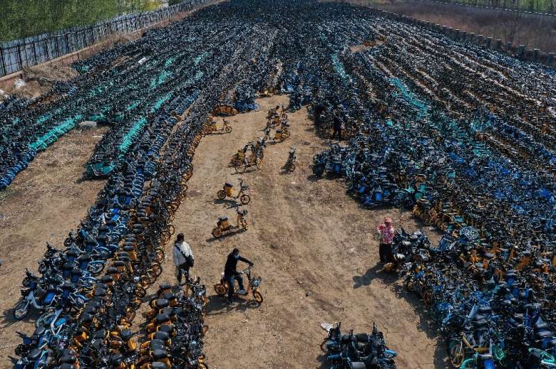 Damaged or abandoned low-cost shared bikes in China often end up in 'graveyards' like this one