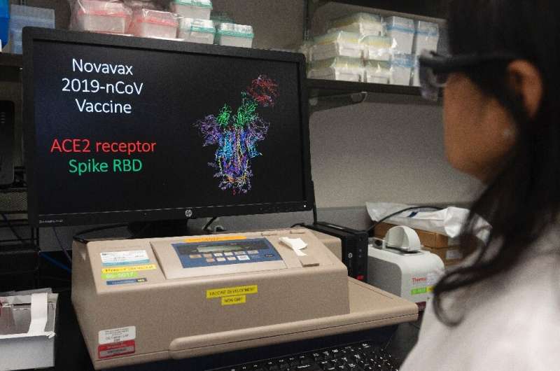 Dr. Nita Patel, Director of Antibody discovery and Vaccine development, looks at a computer model showing the protein structure 