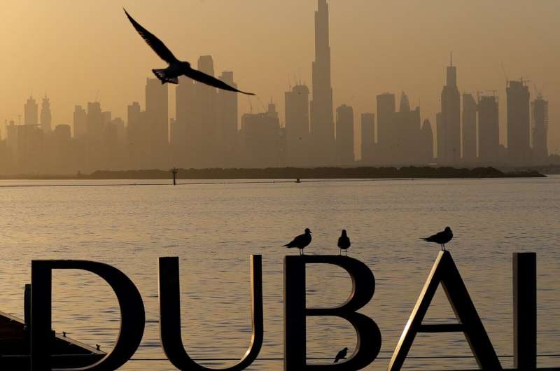 Dubai closes bars, limits activities after virus cases spike