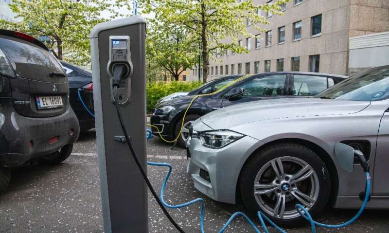 Electric cars being charged on a street in Oslo.Norway has become the first country where more than half of new cars are electri