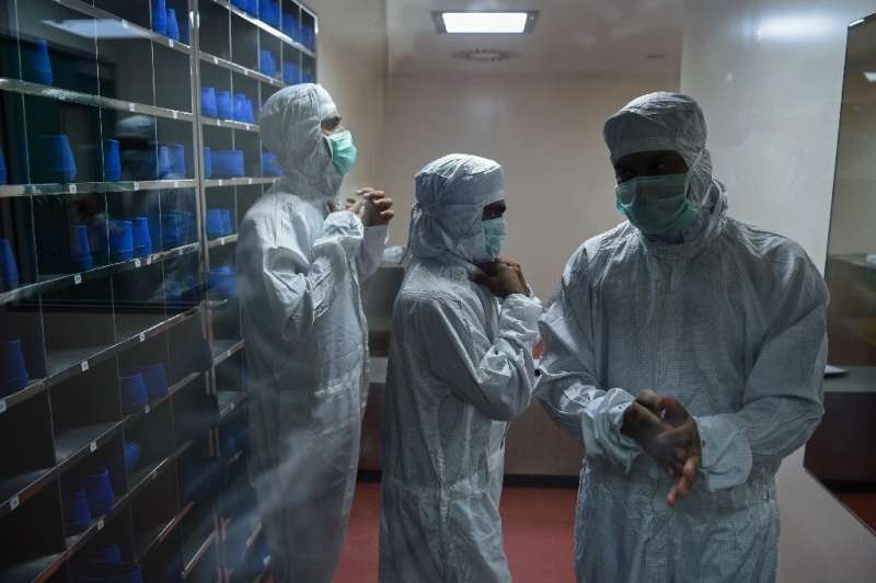 Employees at lab in India that produces Covid vaccines