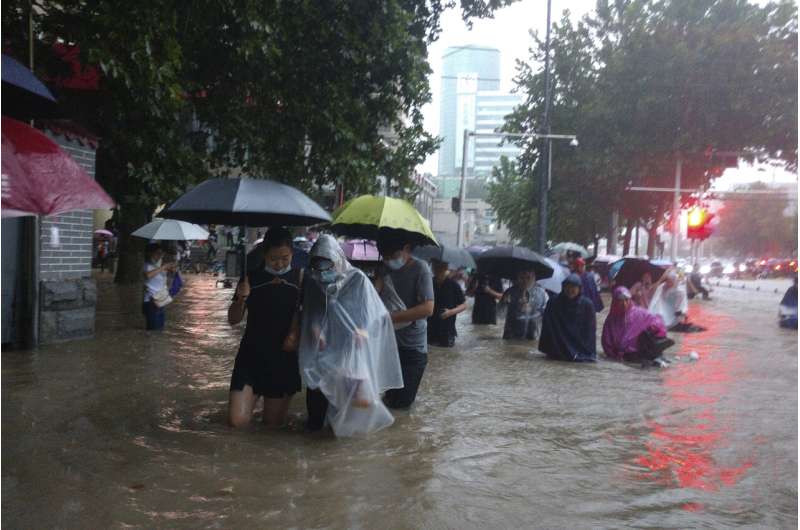 Flooding in central China turns streets to rivers, kills 12