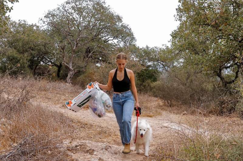 For each bag Elishya Ben Meir fills in the valley near her home in Israel, she receives around 10 'Clean Coins', a virtual curre