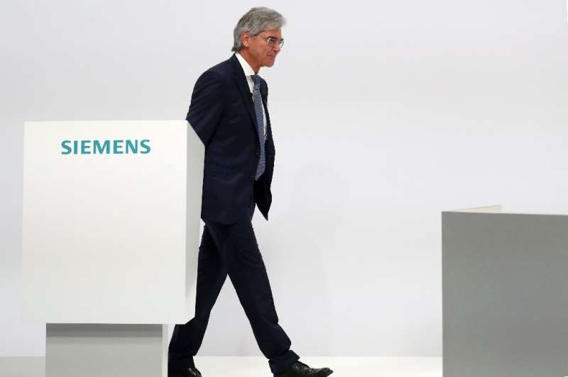 Former Siemens chief executive Joe Kaeser handed over to his deputy Roland Busch