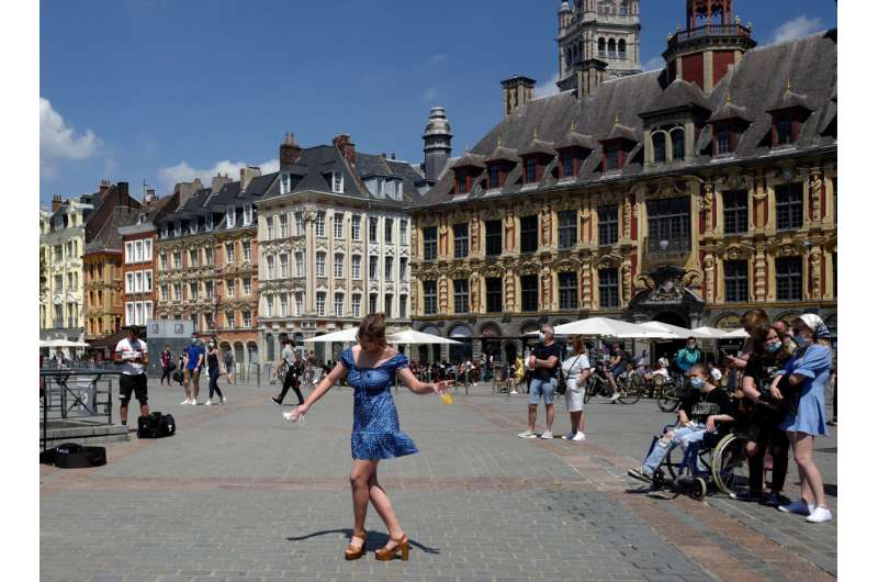 France eases mask rules; will end nightly virus curfew