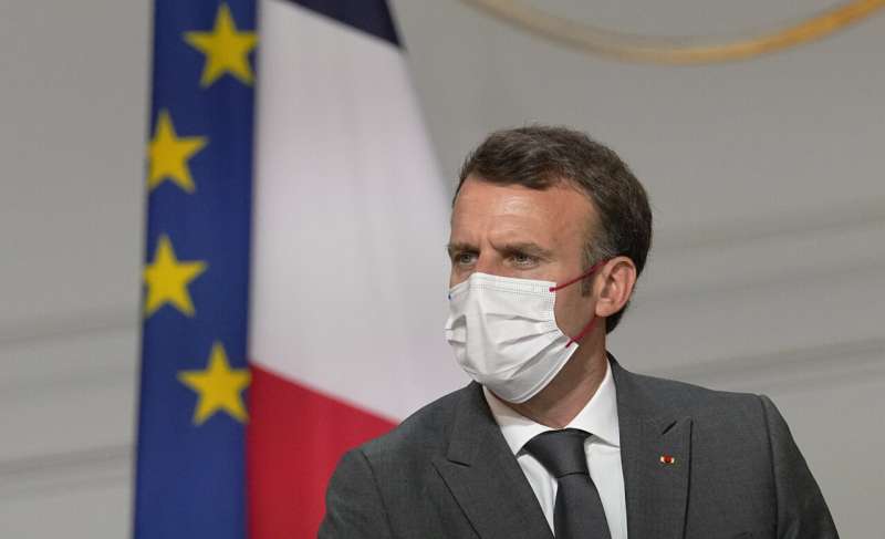 France's Macron orders all health workers to get vaccinated