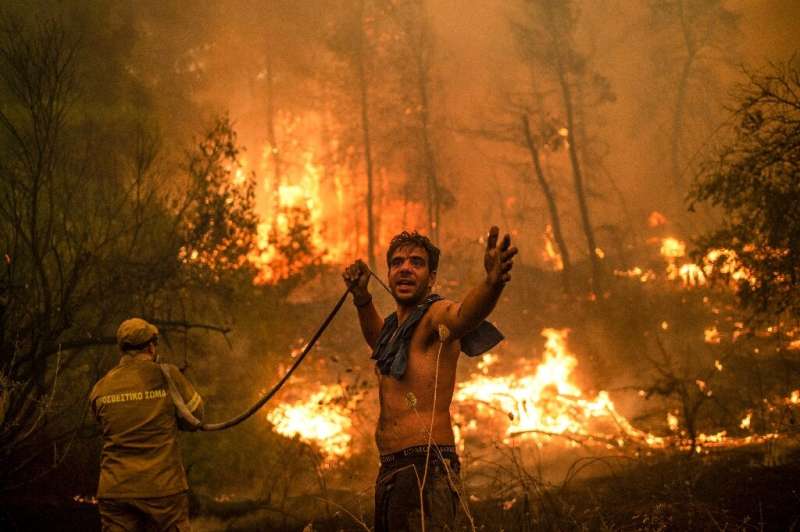 Greece's worst heatwave in decades fanned deadly wildfires that burned nearly 100,000 hectares