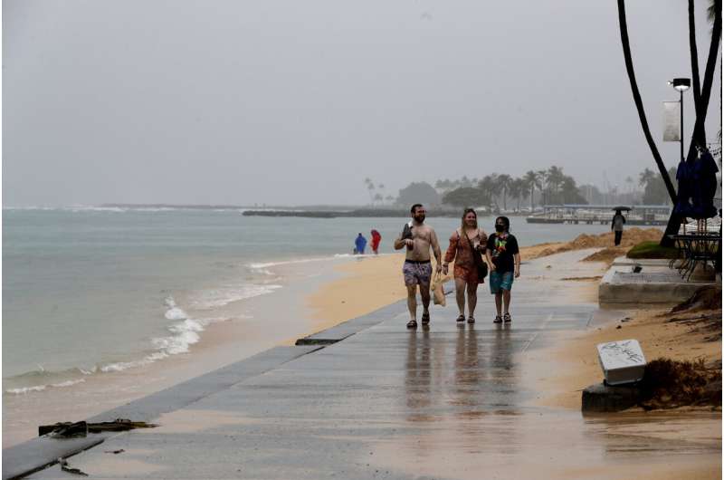 Hawaii recoups from big storm amid lingering flood threats