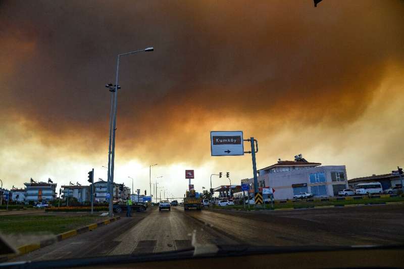 Heavy clouds of smoke rise from a massive forest fire which  engulfed a Mediterranean resort region on Turkey's southern coast n