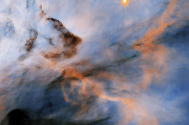 Hubble finds flame Nebula's searing stars may halt planet formation