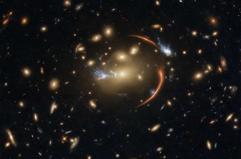 Hubble views a faraway galaxy through a cosmic lens