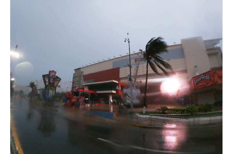 Hurricane Grace buffets a shopping mall in Cancun on August 19, 2021