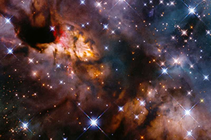 Image: Hubble catches celestial prawn drifting through the cosmic deep