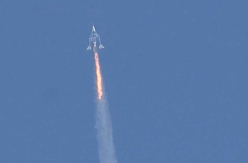 In this photo taken on July 11, 2021 The Virgin Galactic SpaceShipTwo space plane Unity and mothership separate as they fly way 