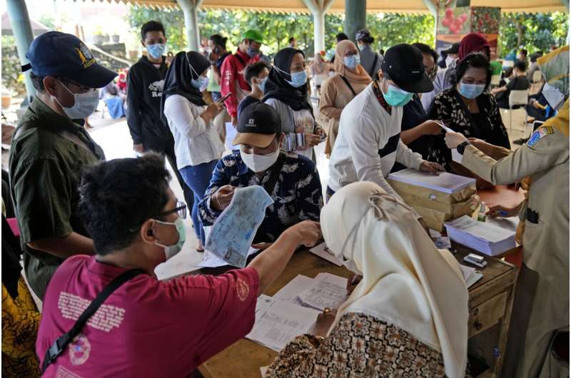Indonesia records its largest 1-day jump in COVID infections