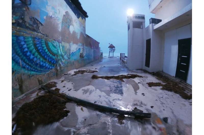 Intense wind and rain caused some damage to structures on the beach in the resort city of Cancun