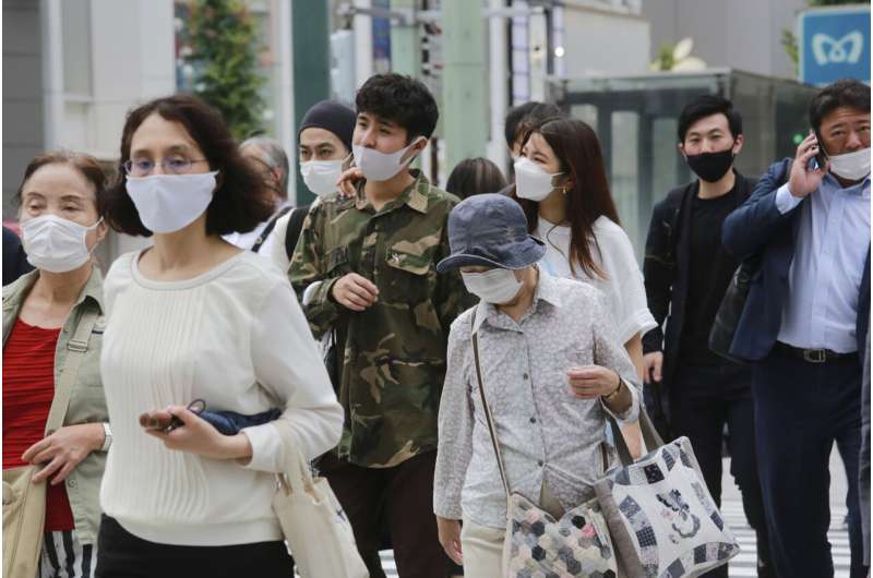 Japan extends, expands coronavirus emergency as cases surge