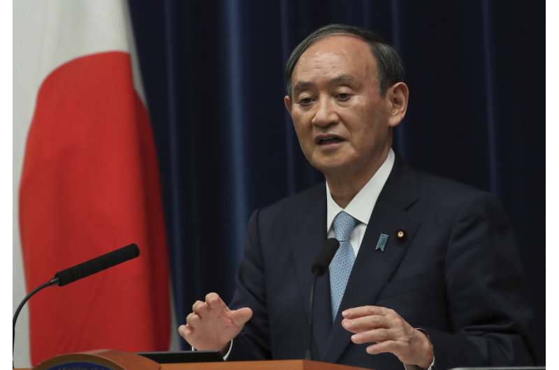 Japan extends virus emergency until end of September