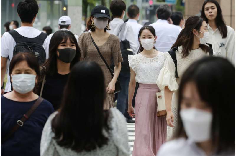 Japan to further expand virus emergency areas as cases surge