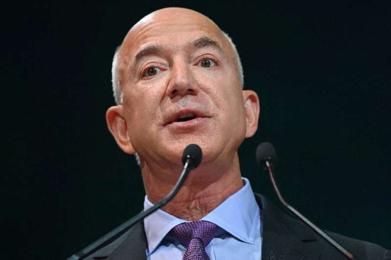 Jeff Bezos, seen during the COP26 UN Climate Change Conference in Glasgow, remains as Amazon's executive chair despite shifting 