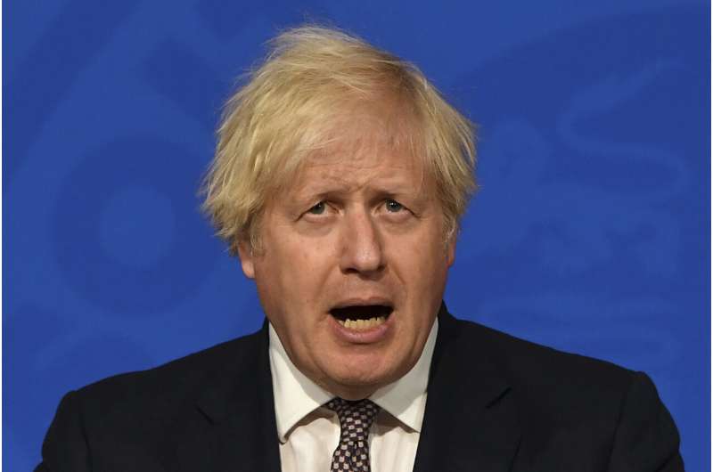 Johnson says restrictions to ease, UK must live with virus