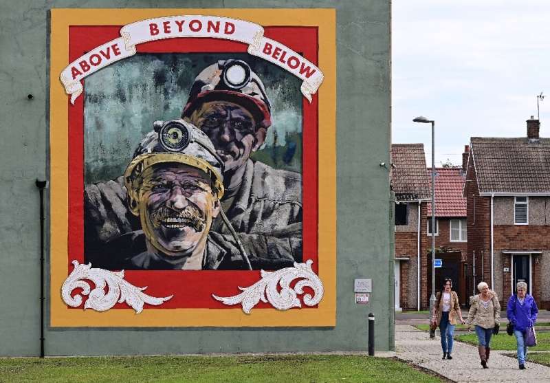 Landmarks around Seaham like a mural by artist Cosmo Sarson remind of the town's coal-mining past