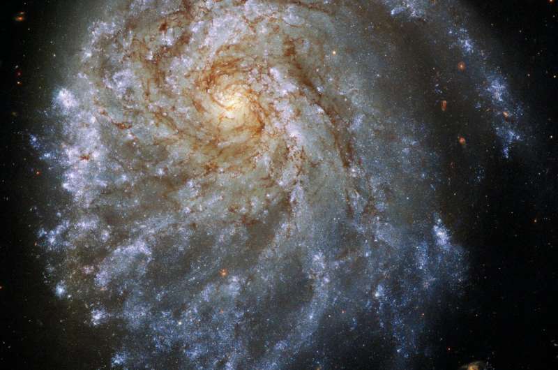 Magnificent spiral galaxy is being stretched by gravity from bypassing neighbor