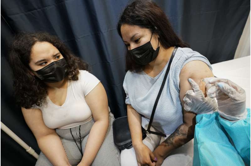 More Americans seek vaccination amid summer infection surge