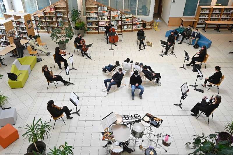 Musicians from the Victor Hugo orchestra play for high school students at the Germaine Tillon high school library in Montbeliard